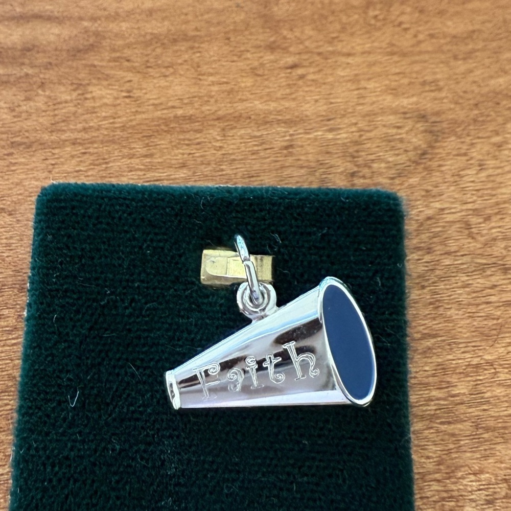 Sterling silver megaphone charm engraved with Faith on it